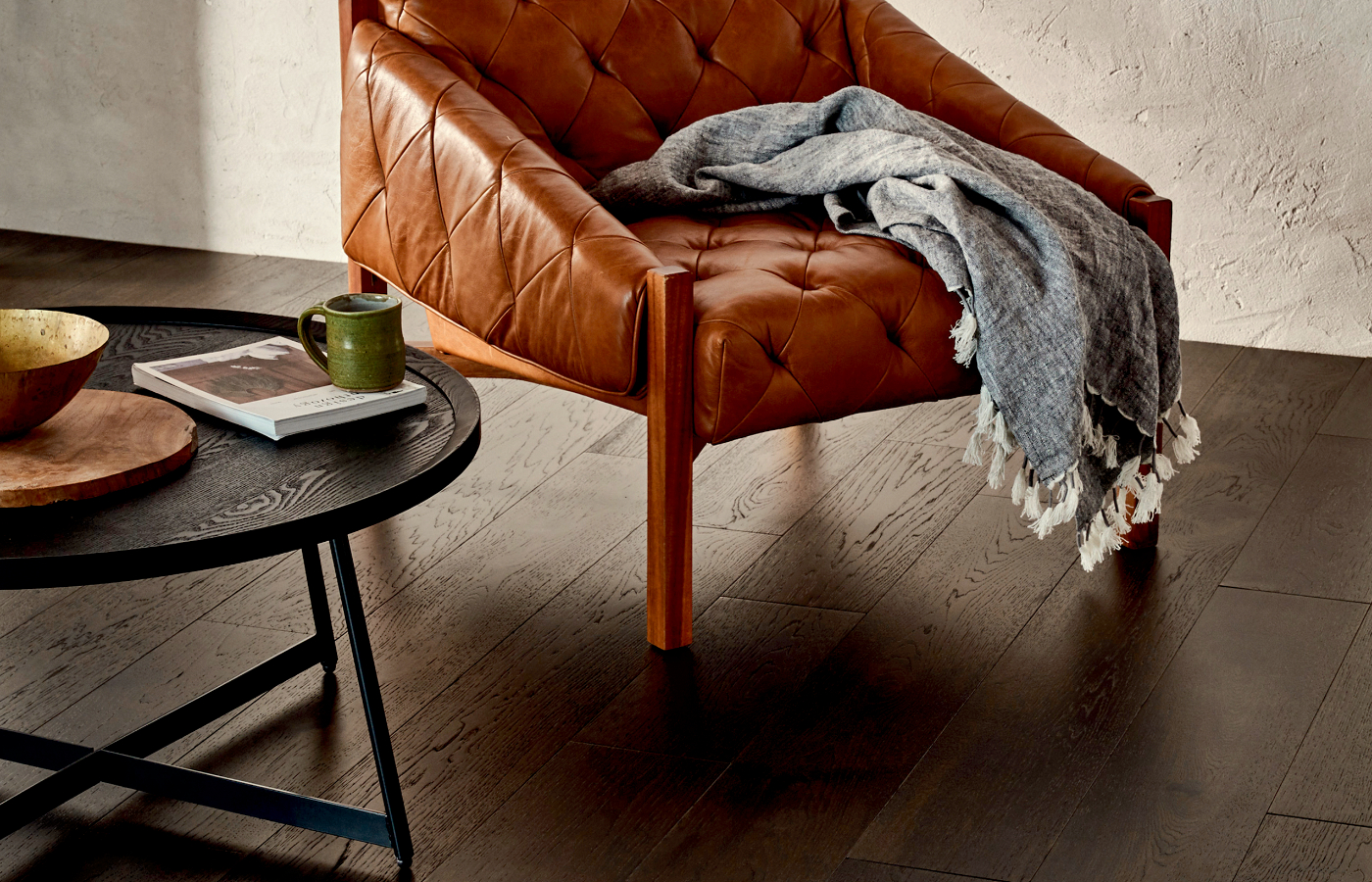 hardwood flooring in sitting area with leather armchair